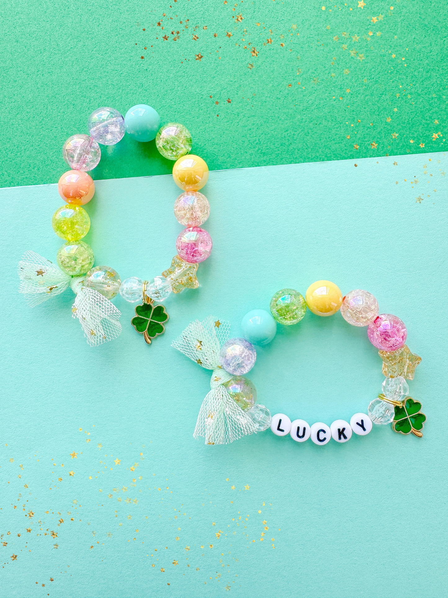 Colorful beaded bracelet with a bow and 'LUCKY' charm on a green and blue background.