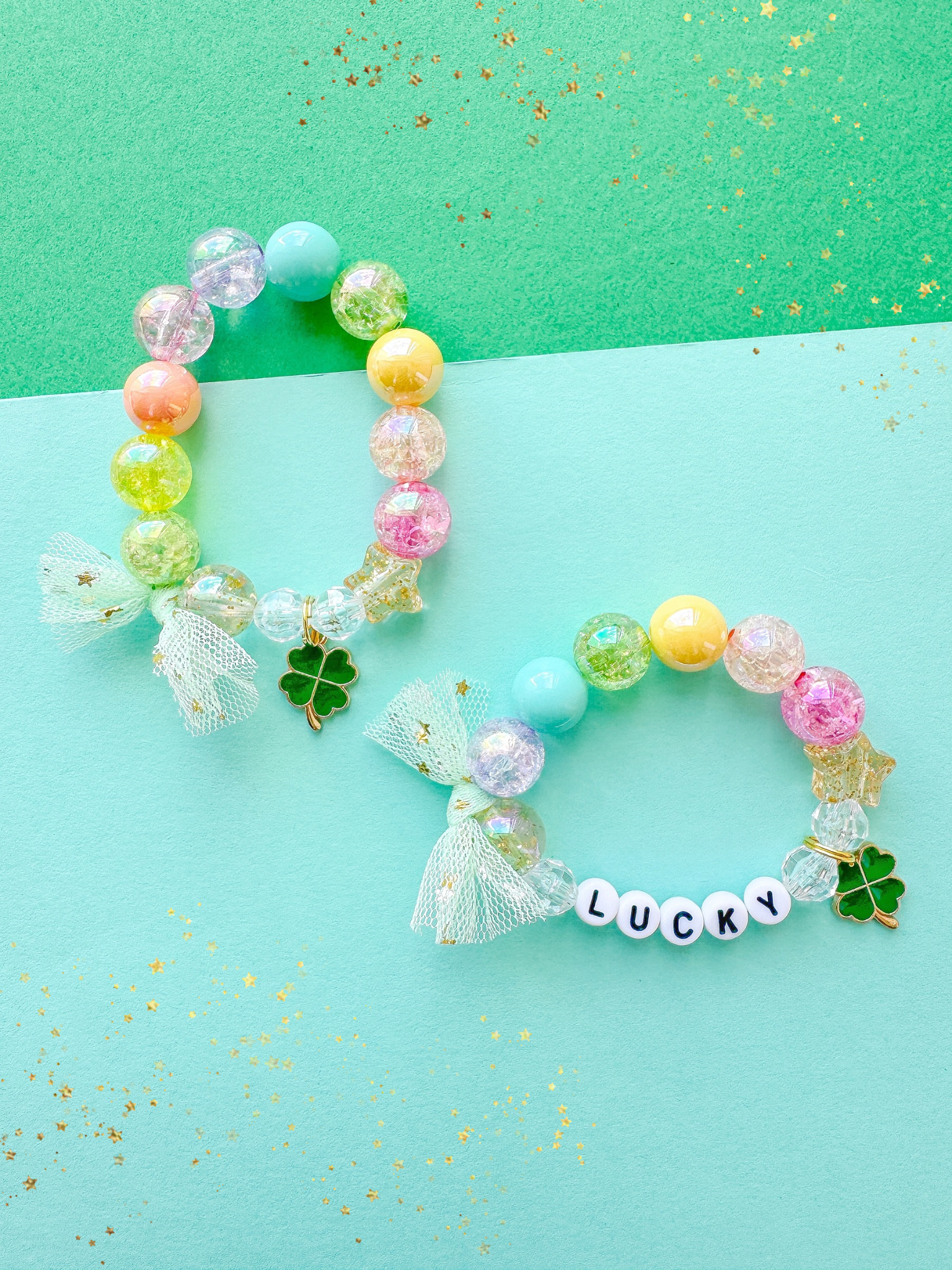 Colorful beaded bracelet with a bow and 'LUCKY' charm on a green and blue background.